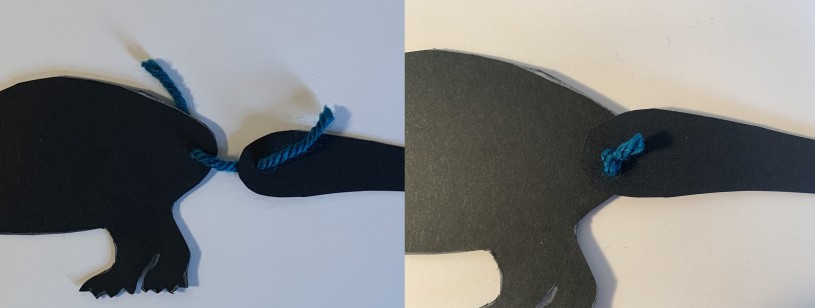 Dinosaur Puppet how-to showing how moving parts connect with brad or yarn