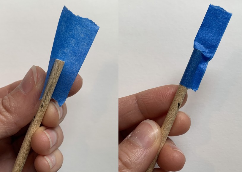 Fold a piece of tape over the end of the dowel/skewer so that the tape is half on the dowel and half off.